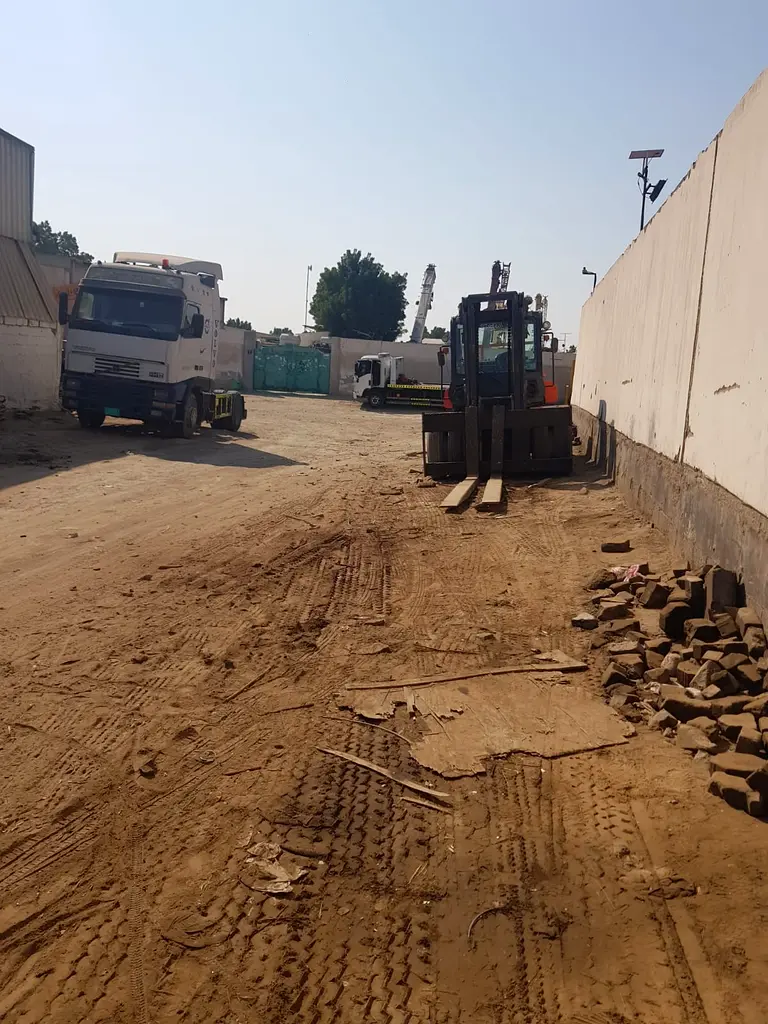 Land for sale in Industrial Area 10, Qar Street, at a reasonable price. In the center of the scrap m