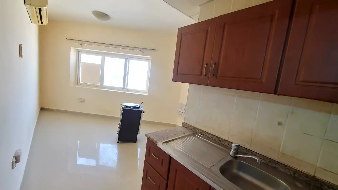 STUDIO AVAILABLE NEAR AL AMAL SCHOOL AND NESTO HYPERMARKET WITH OPEN VIEW