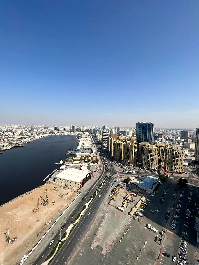 For annual rent in Ajman Al Rashidiya, Oasis Tower, two rooms and a hall, free air conditioning