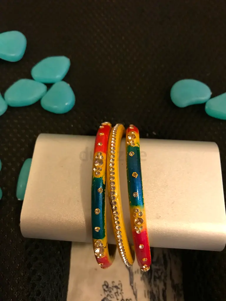 Yellow bangles with Traditional design