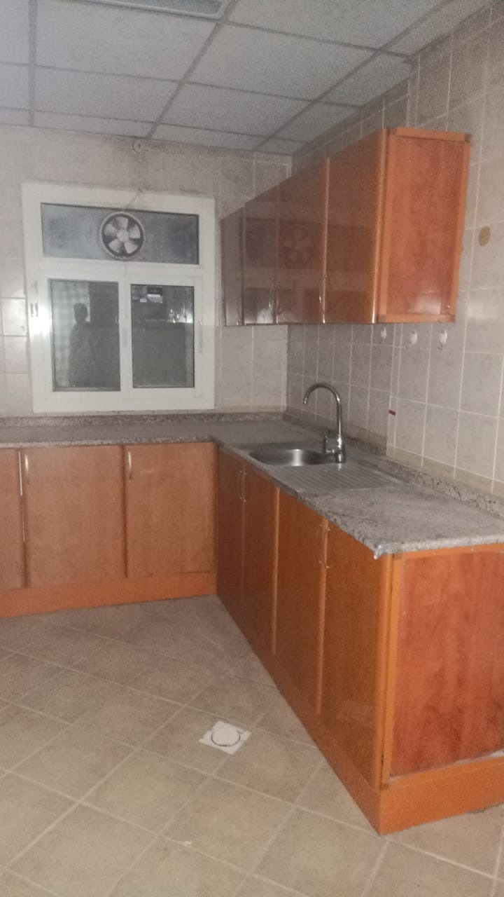 An apartment is available for annual rent, consisting of two rooms and a hall, in Al Hamidiyah (1),