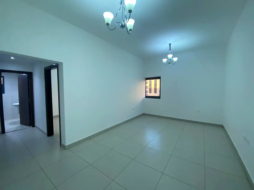 For rent in Ajman, an apartment of three rooms and a hall in Al Rashidiya, close to the gold market,