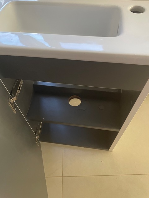 Bathroom sink with cupboard