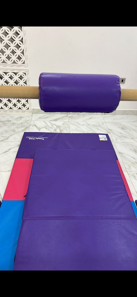 Gymnastics bar (by tumbl trak) with mats and bar pad