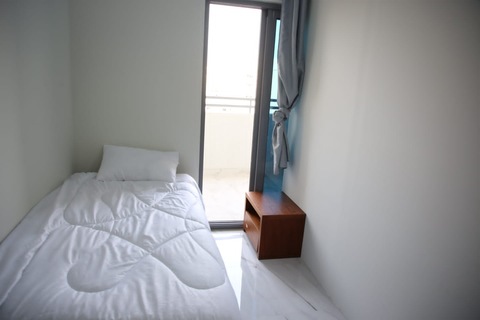 Room with balcony close to Al Rigga metro station and clock