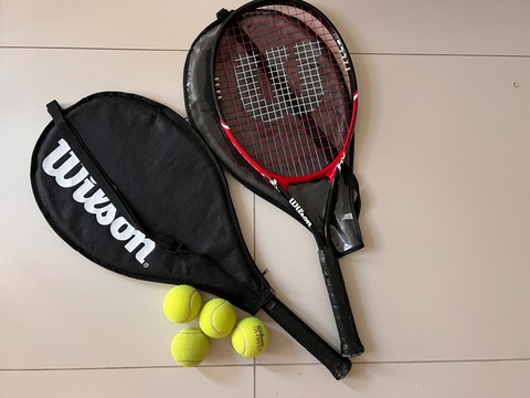 2 Wilson tennis rackets and 4 balls