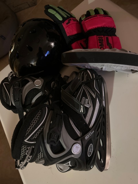 Ice skating boots with helmet and gloves