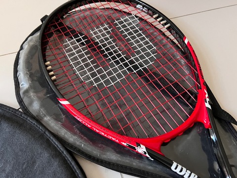 2 Wilson tennis rackets and 4 balls