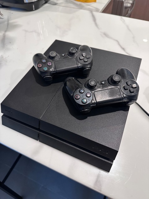 PlayStation 4 1TB with Two Controllers for Sale