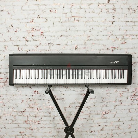 Roland FP1 Piano with mettallic stand and sustain pedal. Cash on Free Delivery with six months warra