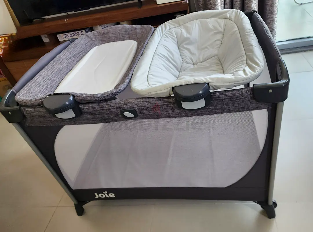 Joie travel cot with wheels