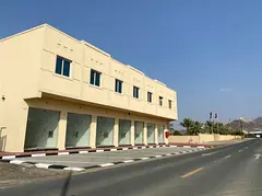 Building In Masfout Main Street In Front Of Court