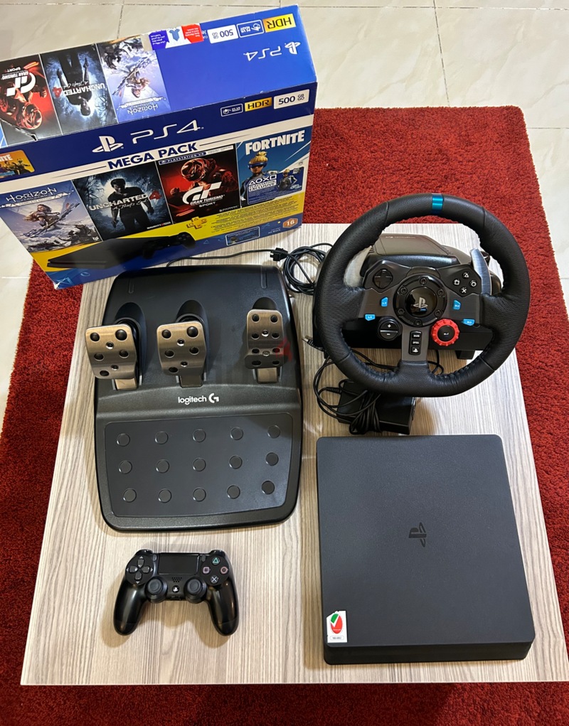 PS4 + 9 Games + Logitech G29 Driving Force Steering Wheel | dubizzle