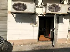 Warehouse With An Industrial Refrigerator For Storing Food - 
