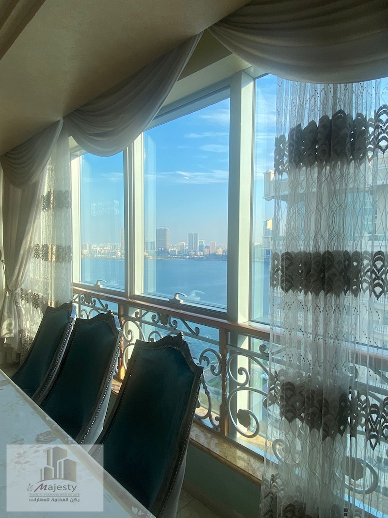 For sale a distinctive apartment with a side sea view in the Emirate of Sharjah, Al Majaz 3 Al Dana
