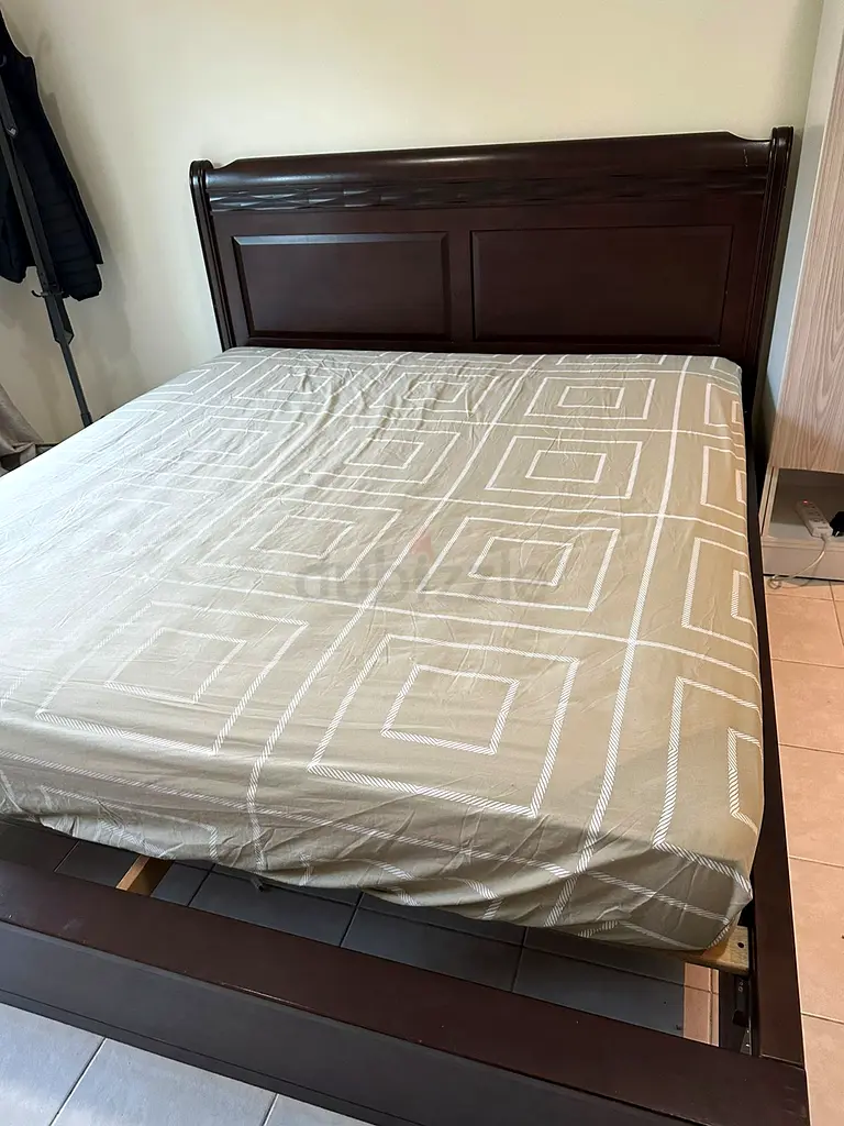 Wooden bed frame with mattress