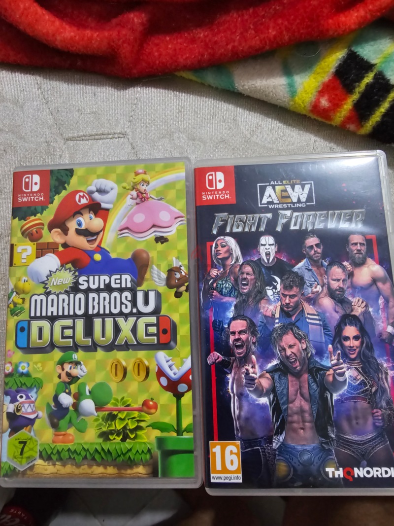 Super Mario and Aew Nintendo switch games | dubizzle