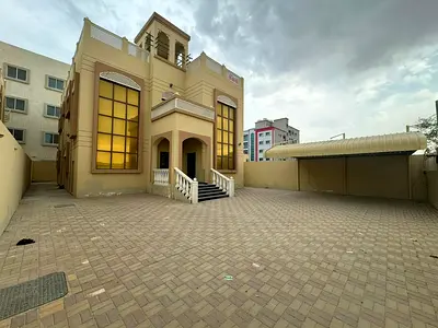 Villa For Rent In Ajman, Al Mowaihat Area, 5 Bedrooms, A Sitting Room, A Hall, And A Maids Room