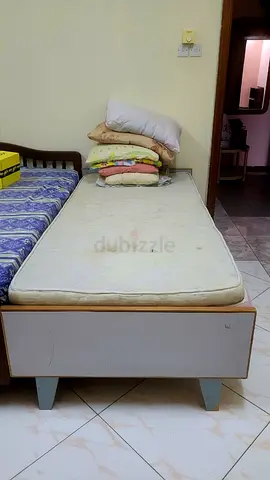 Single wooden bed frame and mattress