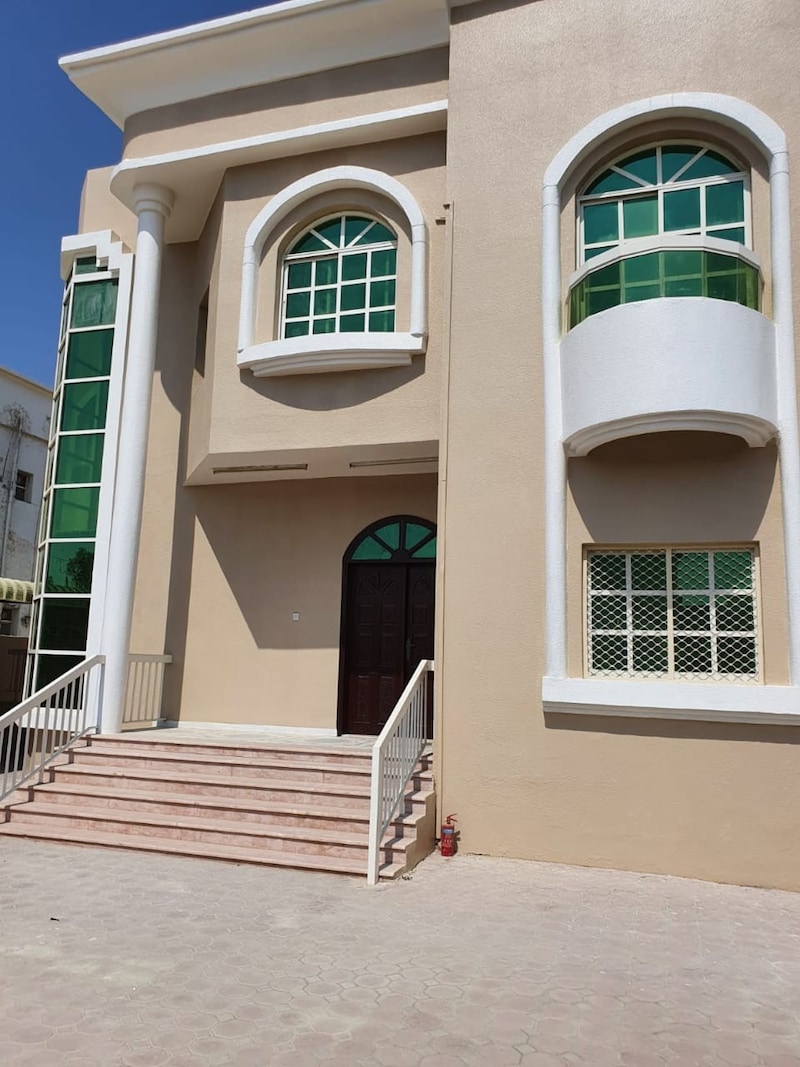 Villa for rent in Ajman, Al Rawda area, consisting of 5 bedrooms, a living room, a living room, a m