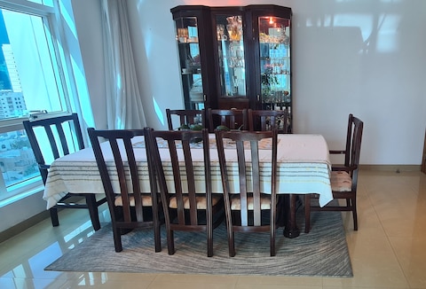 Dining table with 8 chairs and wall display cabinet