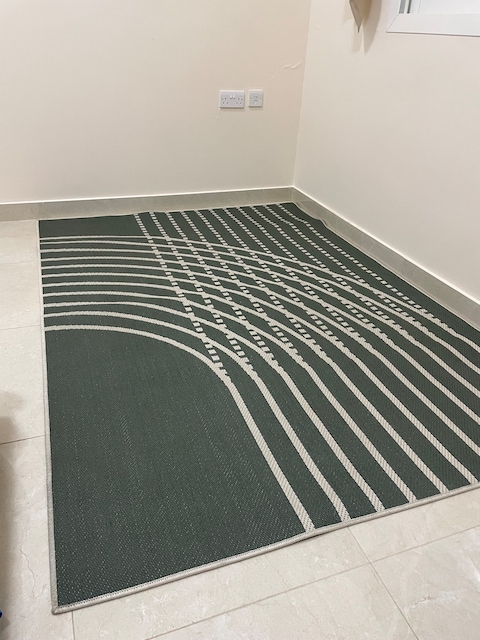 Green and white rug