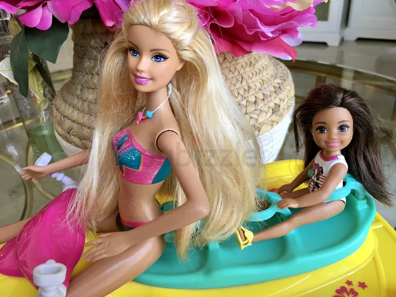 Barbie and little sister on jet ski62863816557314111