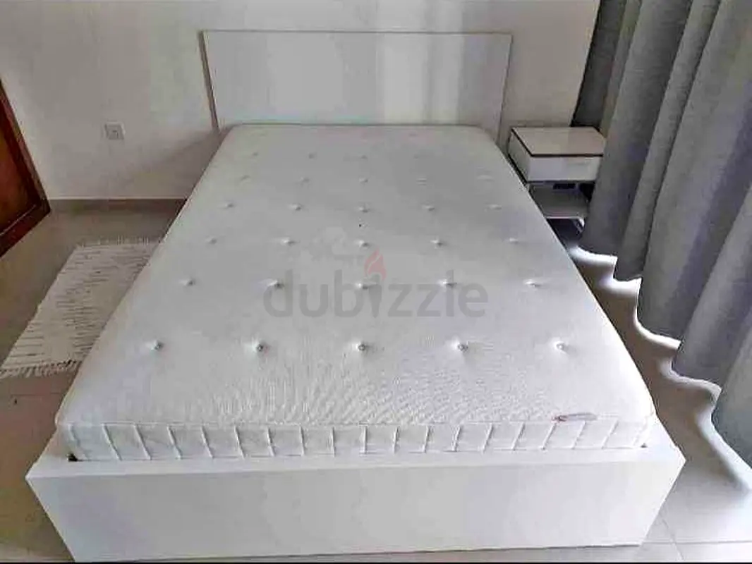 IKEA bed under bed with mattresses and 2 storage drawers underneath, no