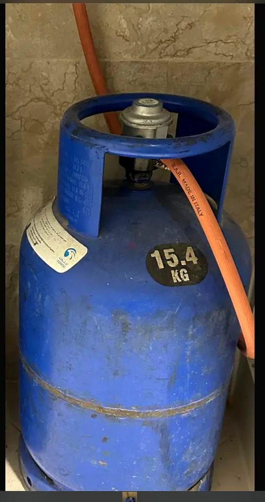 Gas with regulator and still gas inside