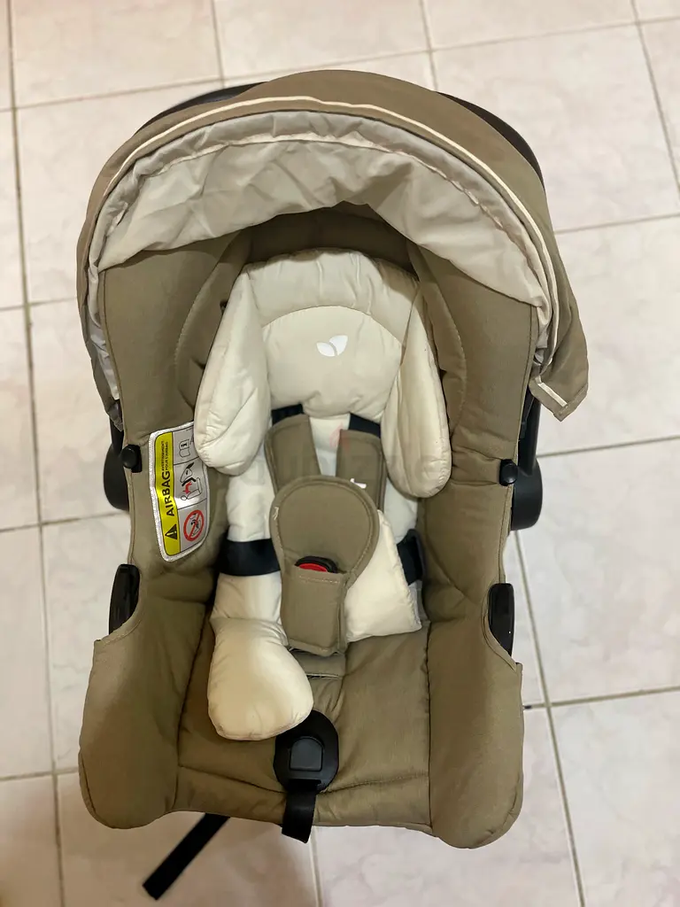 Infant car seat cum carry cot