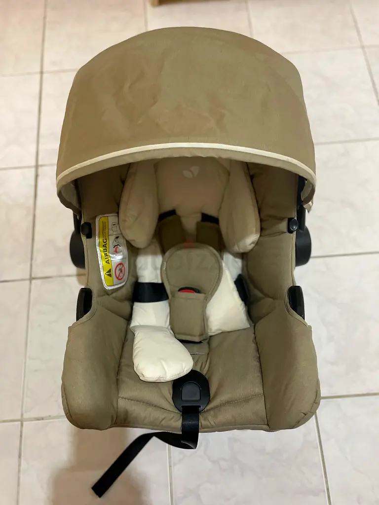 Infant car seat cum carry cot