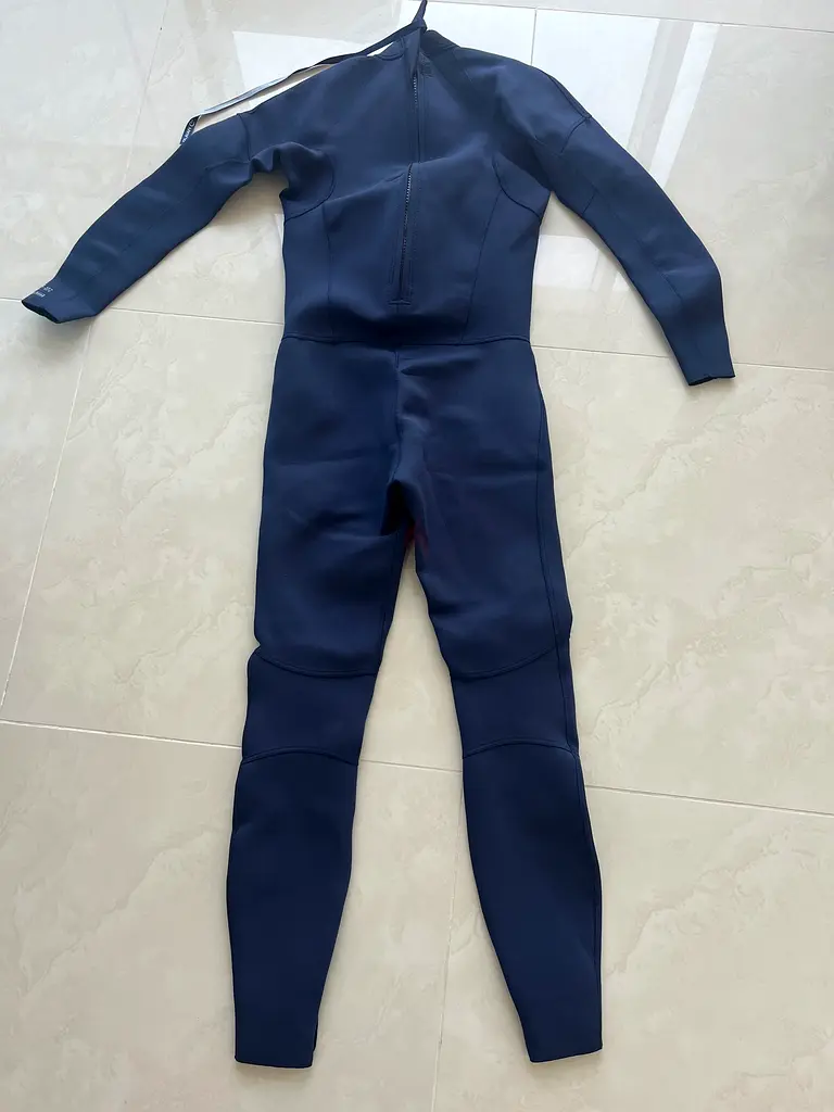 Man/ teenager diving wet suit