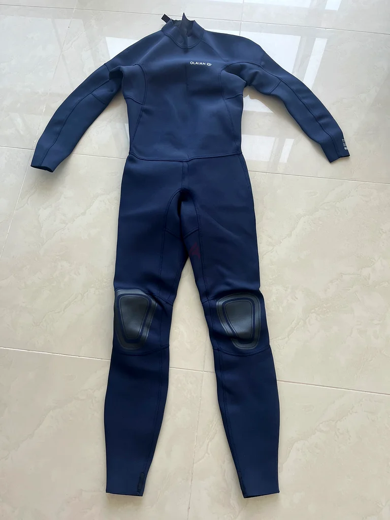 Man/ teenager diving wet suit