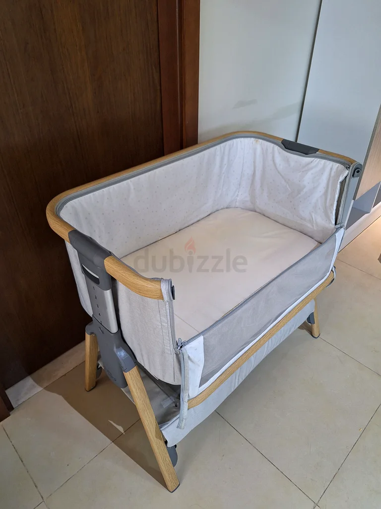 Baby next to me crib