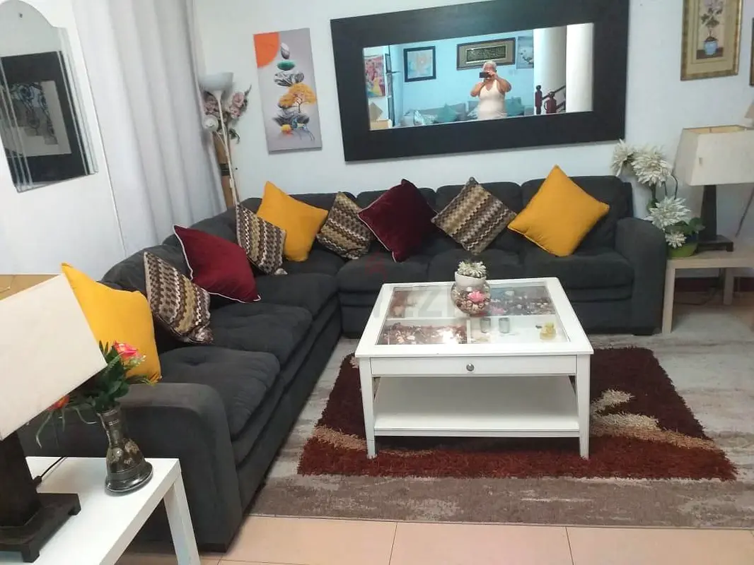 Home centre L shape big sofa dark gray colour with throw away price