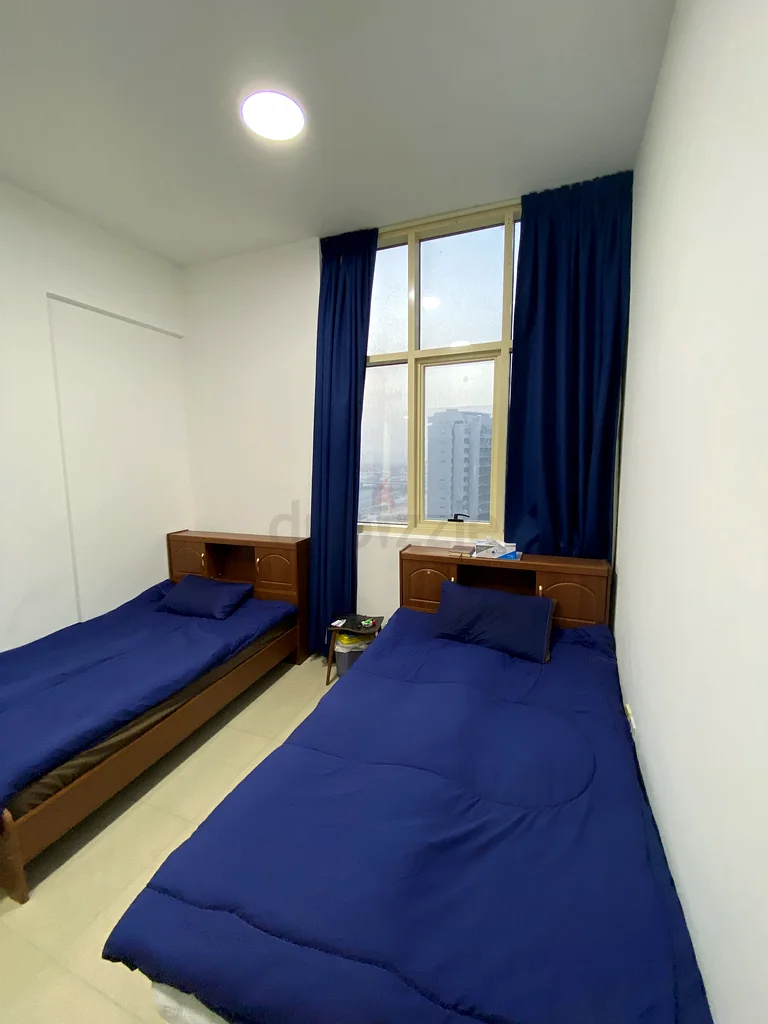 Apartment A bed in a room that has 2 beds and a private bathroom in