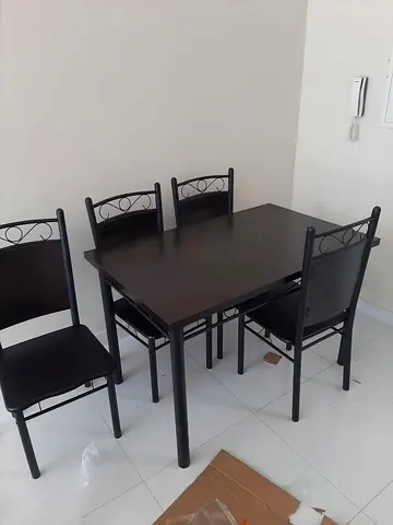 Brand new dining table with 4 chairs available