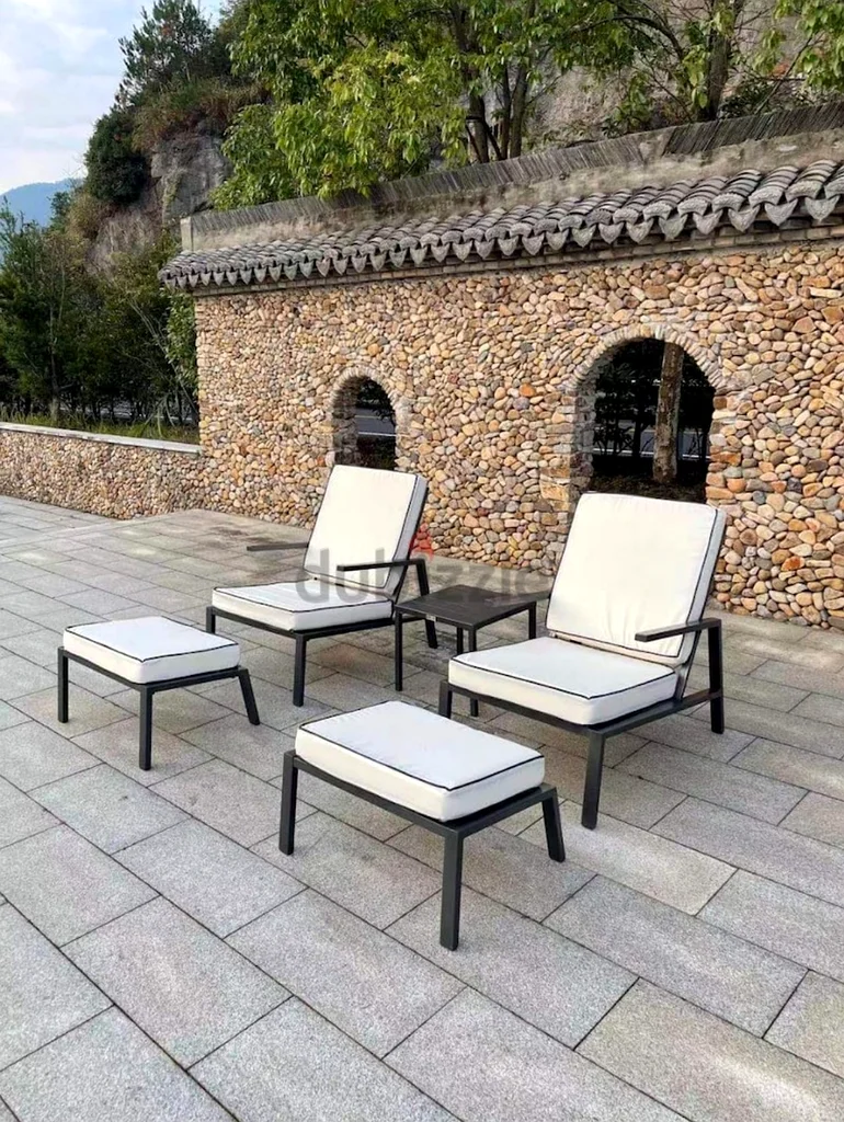 Outdoor garden chairs, table and foot rest set