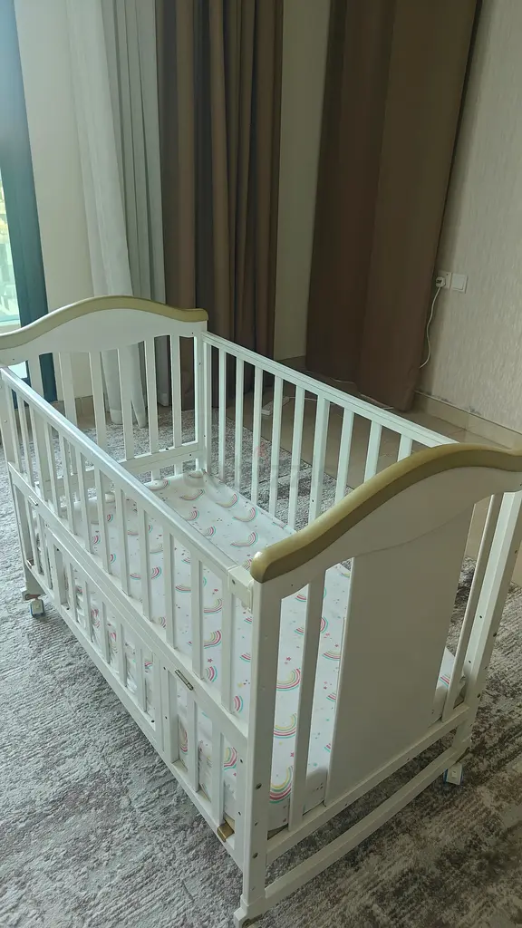 Crib Cosleeper with mattress and beddings. Adjustable