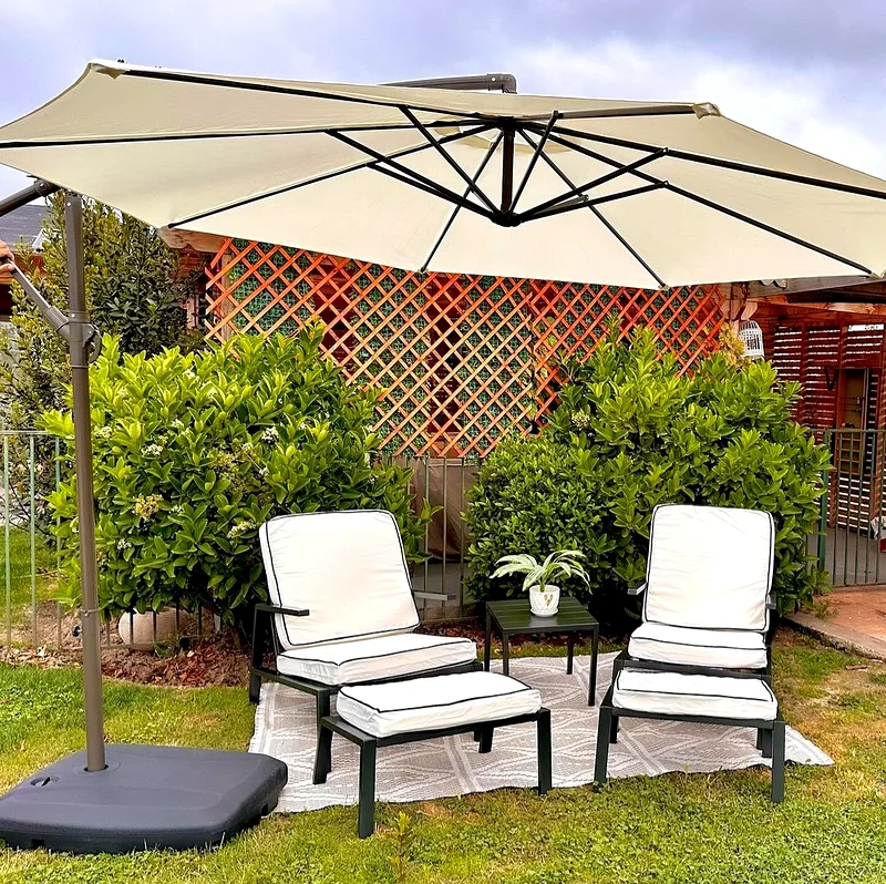 Outdoor garden chairs, table and foot rest set