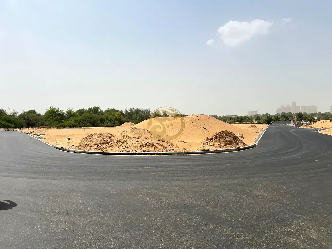 Land For sale Corner plot on two streets, opposite services, in Al