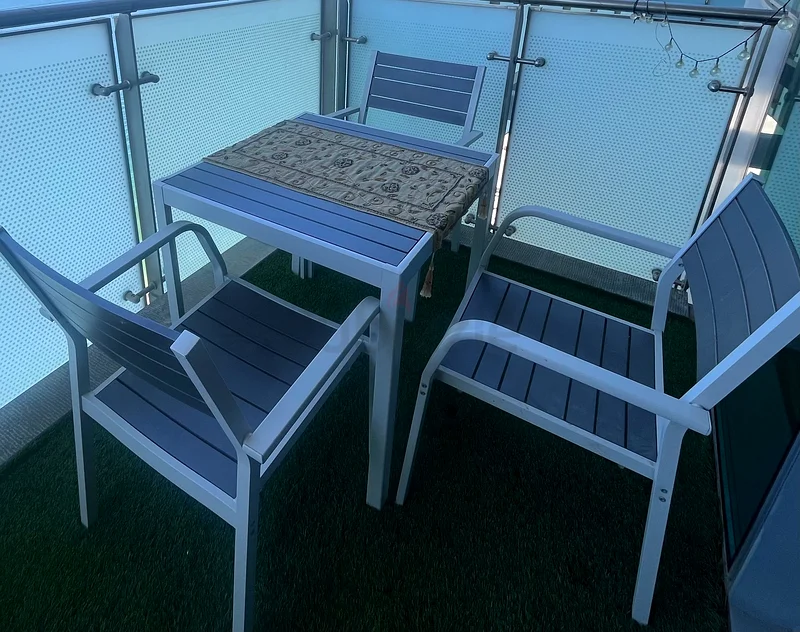 Table and chairs exterior balcony