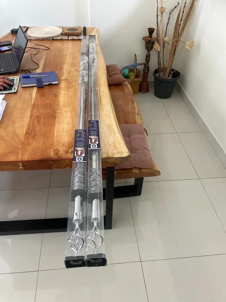 Two spare silver curtain poles (150300cm) never used for opened