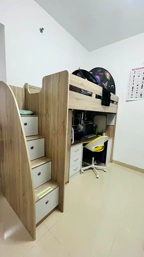 Bunk bed with storage and study table.