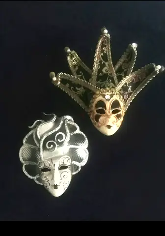 A pair of new wall hanging masks