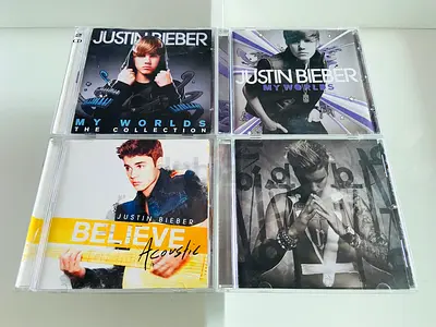 4 Justin Bieber Music CD’s