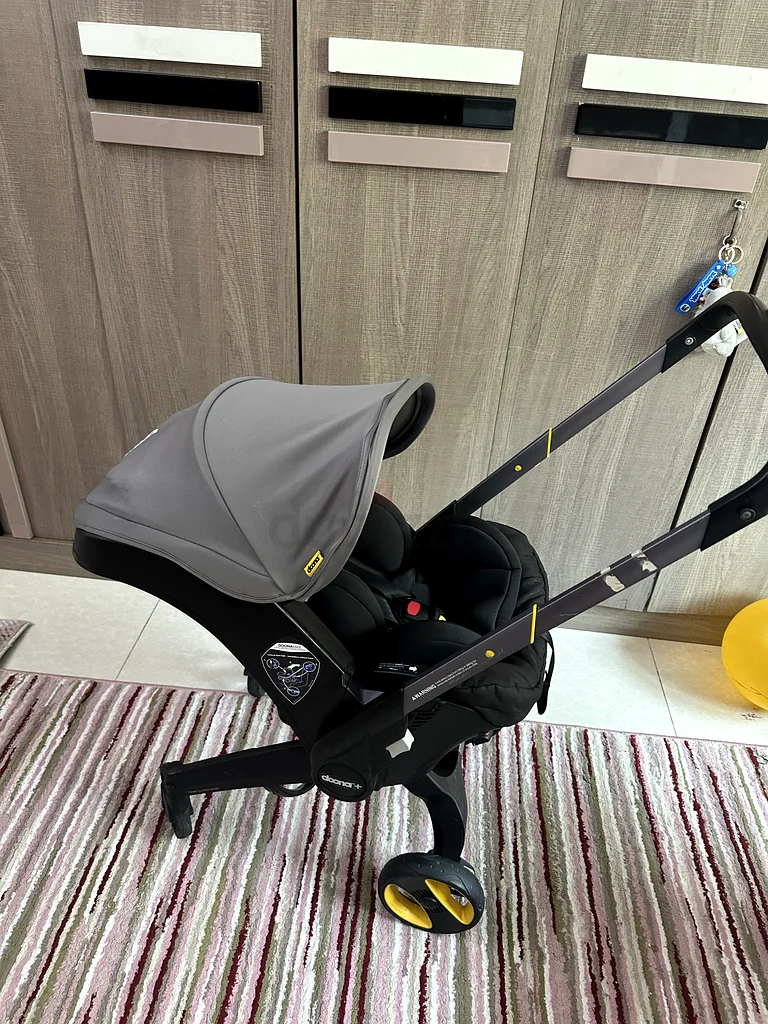 عربة أطفال دوونا بلس ومقعد سيارة بحالة جيدة جدًا63207887897986111