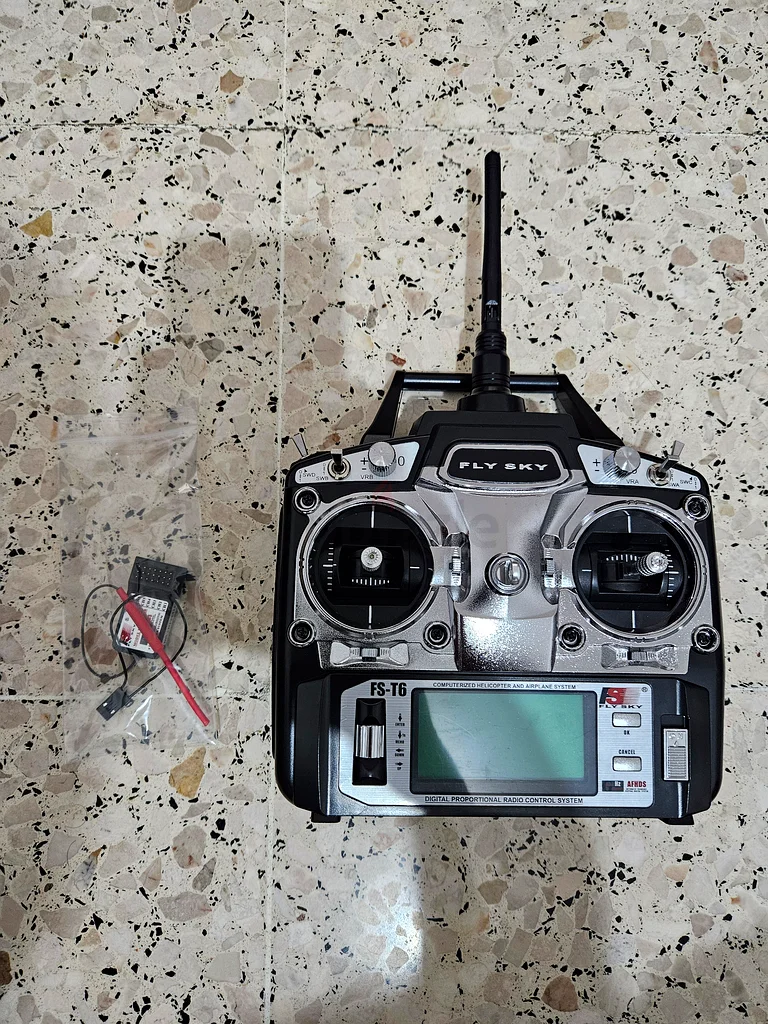 جهاز إرسال لطائرة تُطير عن بعد بست قنوات FlySky63166187014275112