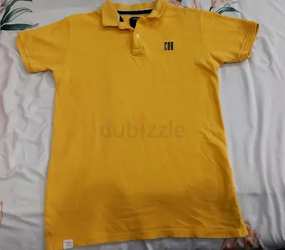 Yellow polo shirt, size 13-14 years