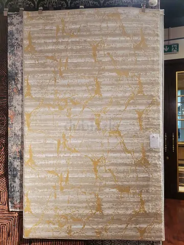 Turkish machine made rug in gold and grey and white color